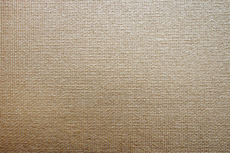 Beige fabric background. A chunky textured fabric with a pattern.