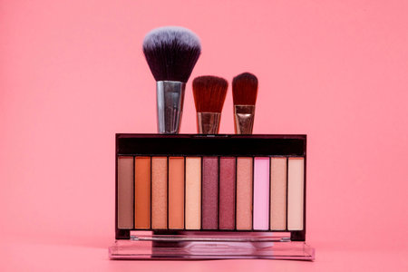 Beauty background with facial cosmetic products with empty copy space. Makeup, skincare concept with pastel colored background.の写真素材