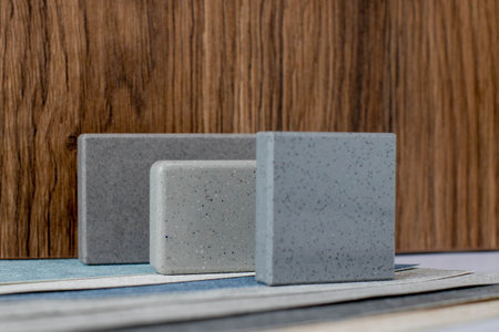 Close up combination of interior material containing set of artficial stone and wooden veneer...