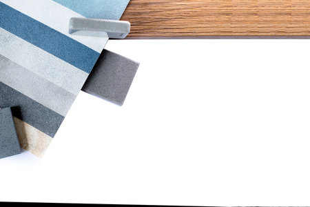 samples of finishing materials, close-up view, including various wooden laminates, interior wallpaper, gray artificial stone.の写真素材