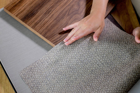 The choice of finishing materials for the design of the house project. The hand of an interior...