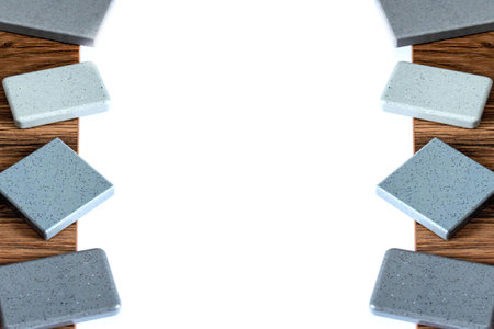 Close up isolate combination of interior material containing set of artficial stone and wooden veneer samples. quartz stone and wooden laminated samples palette background. kitchen countertops color samples.の写真素材