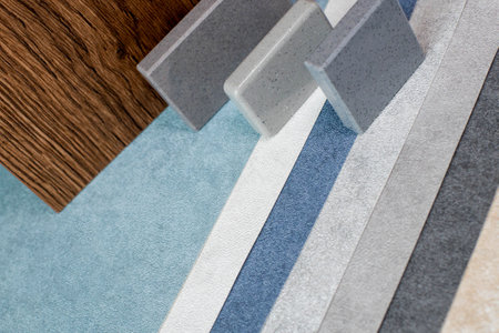Moodboards showing samples of materials for stylization and choice of architects, including fabric wallpaper, quartz stone, chipboard panel.の写真素材