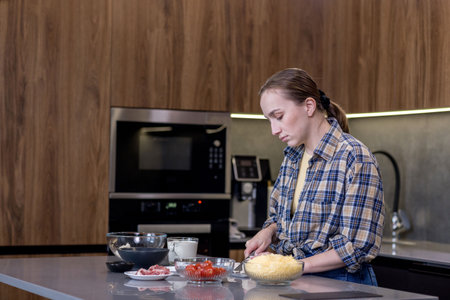 Woman Slicing Ingredients for Quiche in the kitchenの写真素材