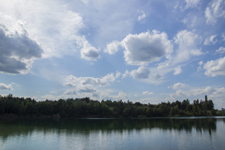 Lake in Woods. Pure lake in the forest. Beautiful sky. Reflectionの写真素材