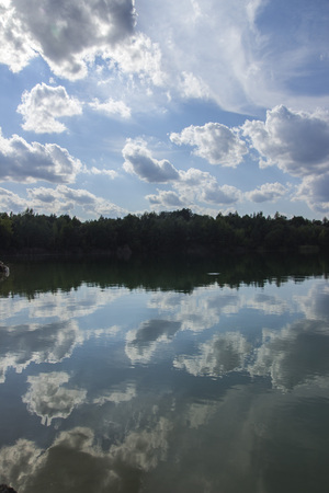 Lake in Woods. Pure lake in the forest. Beautiful sky. Reflectionの写真素材