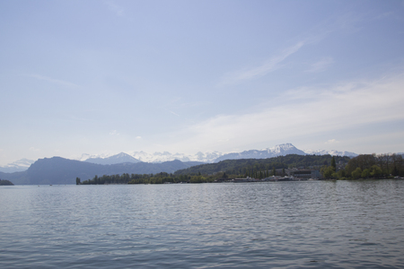A panoramic view of the snow-capped Swiss Alps from the old part of Lucerne, which is located in the center of Switzerland. Blue Lake lucerne.の写真素材