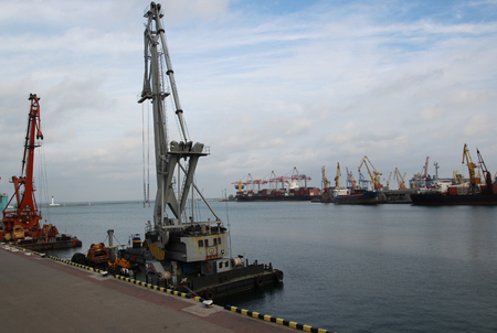 Logistics and transportation of Container Cargo ship and Cargo plane with working crane bridge in shipyard at Twilight sky, logistic import export background and transport industryの写真素材