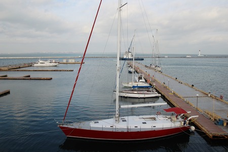 Small private yachts pier in winter Pier with rows of small private yachtsの写真素材