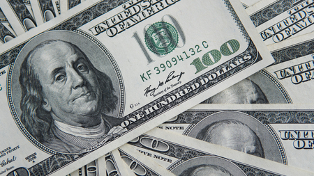 One hundred dollars pile. Money background, heap of dollars, financial concept of earnings. Top view. Financial, bussiness, commercial and banking concept. American dollars in one hundred banknotes.の写真素材