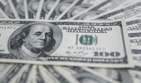One hundred dollars pile. Money background, heap of dollars, financial concept of earnings. Top view. Financial, bussiness, commercial and banking concept. American dollars in one hundred banknotes.の写真素材
