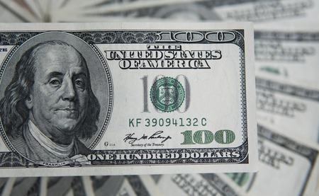 One hundred dollars pile. Money background, heap of dollars, financial concept of earnings. Top view. Financial, bussiness, commercial and banking concept. American dollars in one hundred banknotes.の写真素材