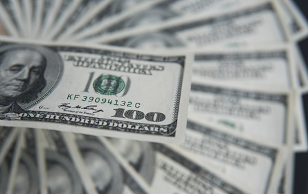 One hundred dollars pile. Money background, heap of dollars, financial concept of earnings. Top view. Financial, bussiness, commercial and banking concept. American dollars in one hundred banknotes.の写真素材
