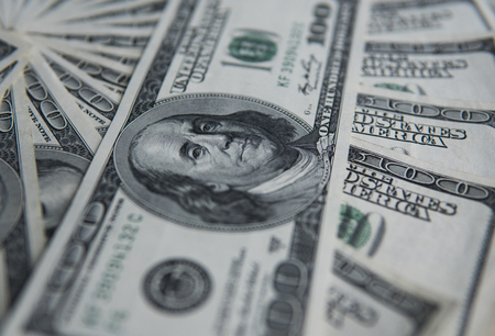 One hundred dollars pile. Money background, heap of dollars, financial concept of earnings. Top view. Financial, bussiness, commercial and banking concept. American dollars in one hundred banknotes.の写真素材