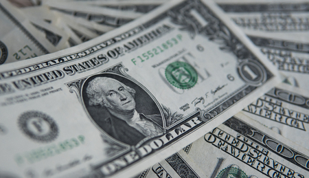 One american dollar banknote. Money background, heap of dollars, financial concept of earnings. Top view. Financial, bussiness, commercial and banking concept. One dollar close up.の写真素材