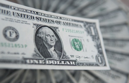 One american dollar banknote. Money background, heap of dollars, financial concept of earnings. Top view. Financial, bussiness, commercial and banking concept. One dollar close up.の写真素材