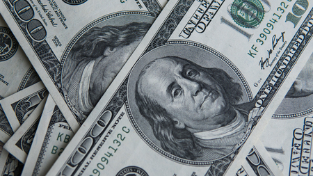 One hundred dollars pile. Money background, heap of dollars, financial concept of earnings. Top view. Financial, bussiness, commercial and banking concept. American dollars in one hundred banknotes.の写真素材