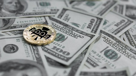 Golden Bitcoins on US dollars. Digital currency close-up. New virtual money. Crypto currency top view. Real coins of bitcoin on banknotes of one hundred dollars. Exchange. Bussiness, commercial.の写真素材