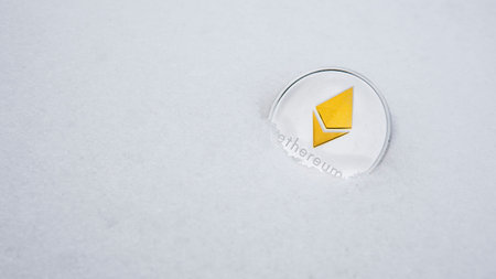 Ethereum cryptocurrency on snow. The concept of freelancing, the stock exchange. Ethereum on cold...