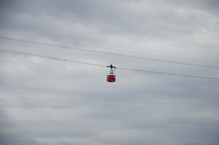 Red cabin on cableway. Red cable car in the sky of Barcelona, Spain.の写真素材