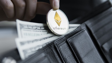 Ethereum coin and hundred dollars bills in leather wallet. Ethereum with dollar in purse. Profit from mining crypto currencies. Miner with dollars and gold Ethereum money. Bussiness, commercial.の写真素材