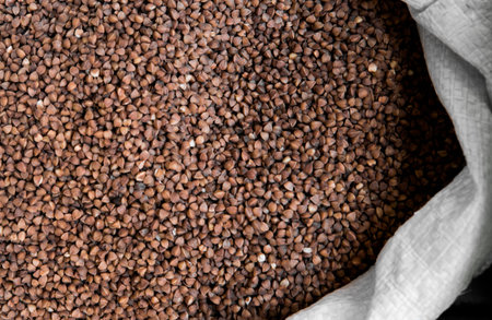 Buckwheat groats in a bag. Macro. resh clean useful buckwheat groats grain close-up. Healthy dietary food rich in microelements cellulose.の写真素材
