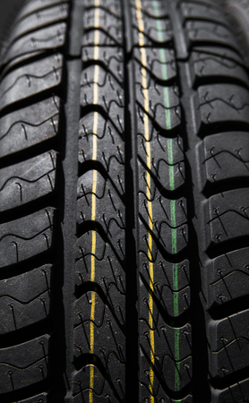 Protector of automobile tires. Close up view on auto mobile new wheel tire surface. Car constraction industry commercial transport transpotration.の写真素材