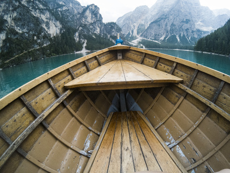 Nose of wooden boat at the alpine mountain lake. Lago di Braies, Dolomites Alps, Italy.の写真素材