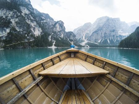 Nose of wooden boat at the alpine mountain lake. Lago di Braies, Dolomites Alps, Italy.の写真素材