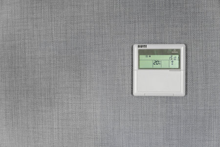Wall display shows air temperature inside the apartment room. Smart home automation. Showing...