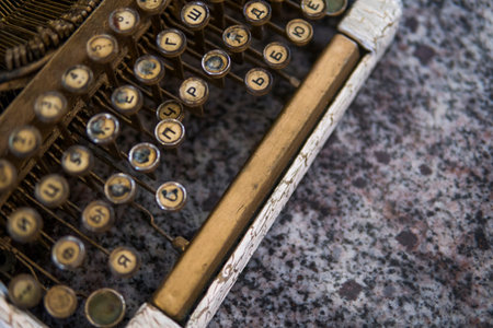 Close up view on an old dirty broken antique typewriter machine keys with Cyrillic symbols letters.