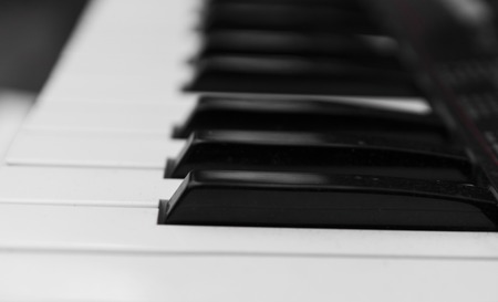 Synthesizer piano key board side view.Professional electronic midi keyboard with black and white keys.の写真素材