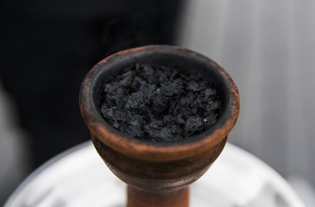 Tobacco for hookah in a clay bowl for shisha smoke.の写真素材