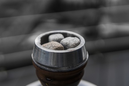 Close-up of a top of hookah with coconut coal.の写真素材