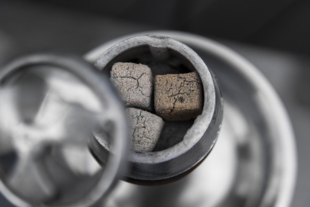 Close-up of a top of hookah with coconut coal.の写真素材