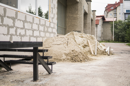 Pile of sand, cement mixed, use during house building.の写真素材