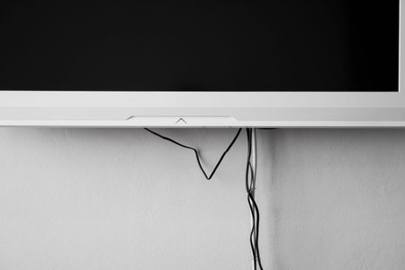 LCD or LED tv screen hanging on the wall with a tv tuner in room for interior decoration design. Comfortable home.の写真素材