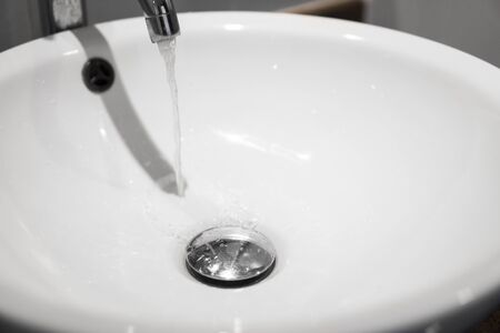 Round white sink in the bathroom close up.の写真素材