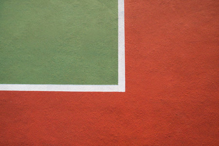 Marking on the tennis court close up in red and green color.