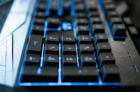 Gamer keyboard with colorful blue lights, modern gamer computer. Blue backlight, backlit on laptop or keyborad computer of gaming.の写真素材