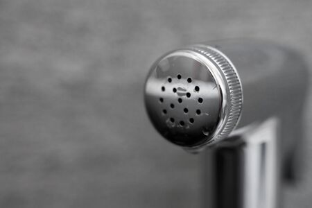Close Up on a bidet shower head.の写真素材