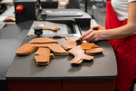Different forms of leather pieces which will be use for making a shoes on a shoes factory. Prepared,...