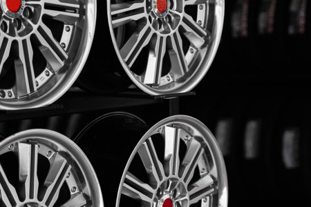 ar drives in the store with black background. Chrome car wheels for sale.