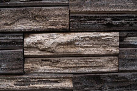 Natural stone bricks as a decoration on a wall. Natural stone wall texture. The walls are made of...
