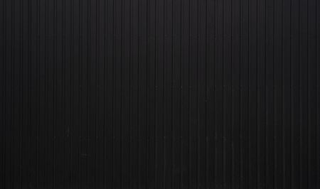 Black Corrugated metal sheet texture surface of the wall. Galvanize steel backgroundの写真素材