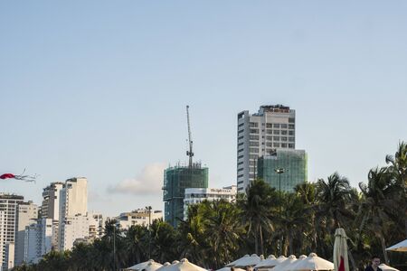NHA TRANG, VIETNAM - JANUARY 25, 2019. Scenic summer view of the modern architecture with business skyscrapers, hotels and apartment buildings with a palm trees.のeditorial素材