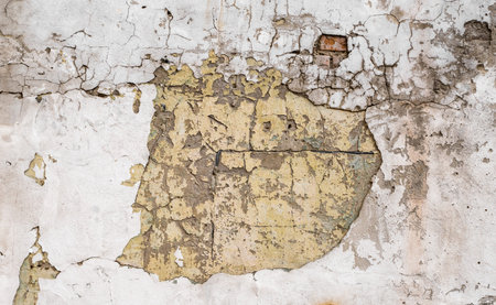 Cracked concrete grey wall covered with gray cement texture as background can be used in design....