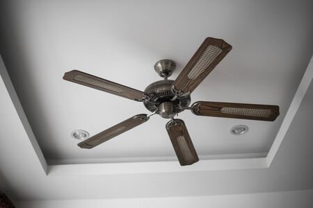 Picture of wooden ceiling fan inside the living room.の写真素材