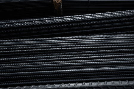 Building armature in the warehouse of metallurgical products or on construction site. Stack of heavy...