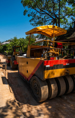 Road rollers working on the new roads construction site. Heavy duty machinery working on highway....